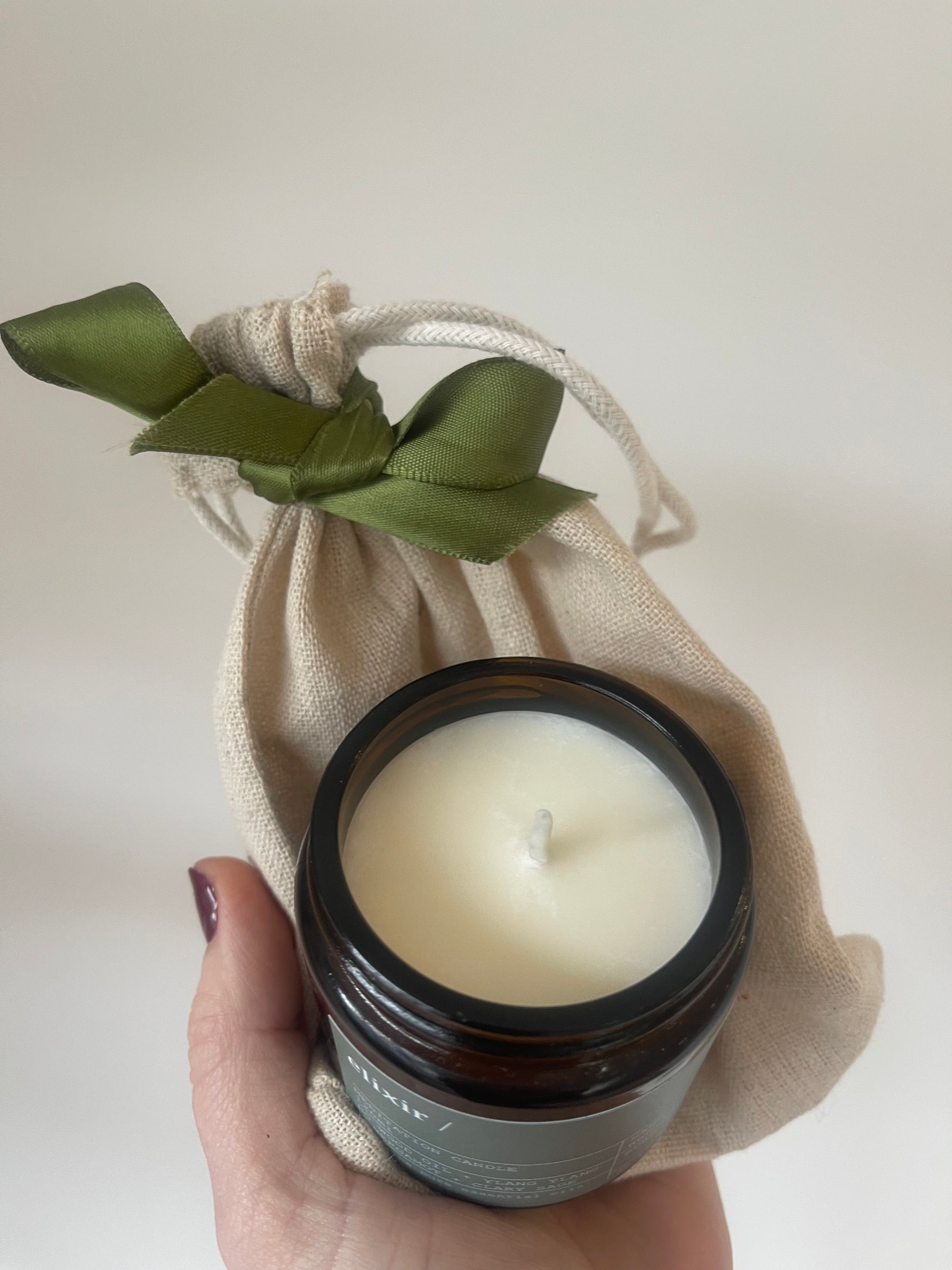 elixir small candle in a muslin bag